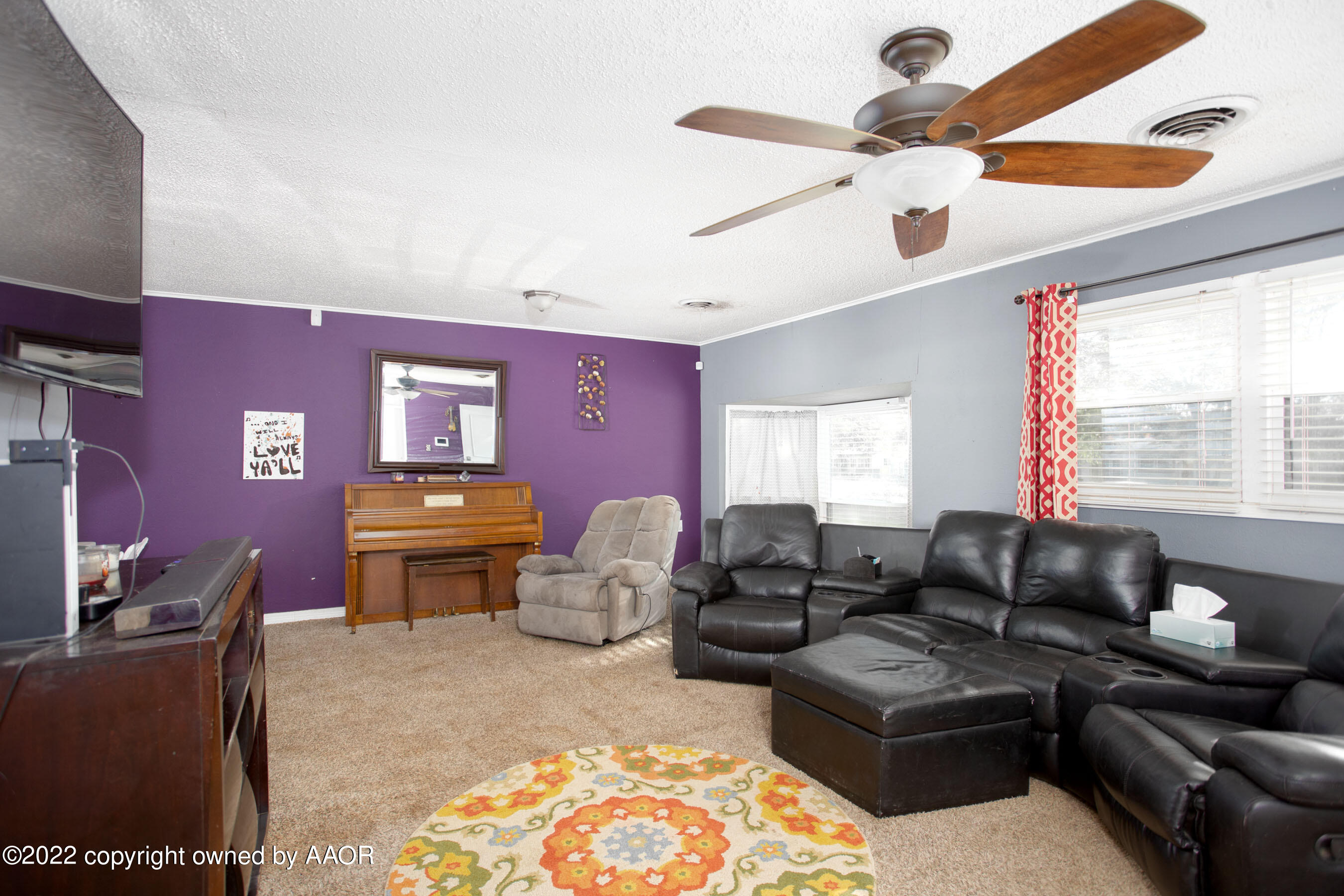 5310 Tumbleweed Drive Amarillo, TX 79110 - Photo 7 of 23 a living room with furniture a rug and a window