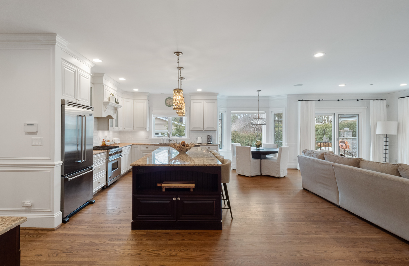 611 Wisner Street Park Ridge, IL 60068 - Photo 11 of 36 a kitchen with stainless steel appliances kitchen island granite countertop a refrigerator a stove a sink dishwasher a oven and a dining table with wooden floor