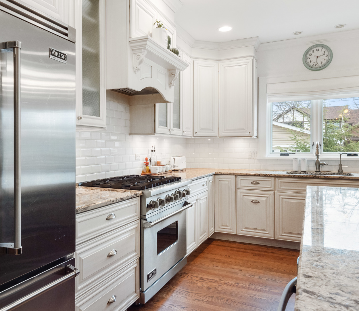 611 Wisner Street Park Ridge, IL 60068 - Photo 12 of 36 a kitchen with stainless steel appliances granite countertop a stove a sink and a refrigerator