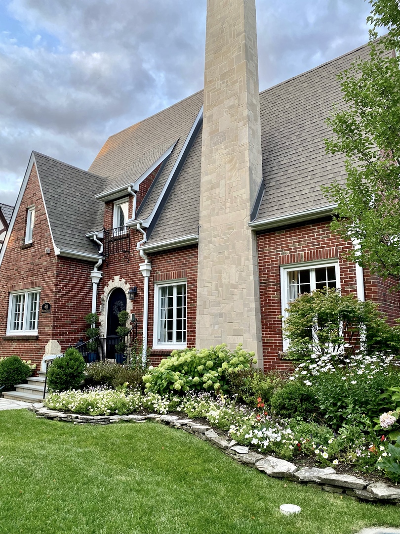 611 Wisner Street Park Ridge, IL 60068 - Photo 2 of 36 a front view of a house with a yard