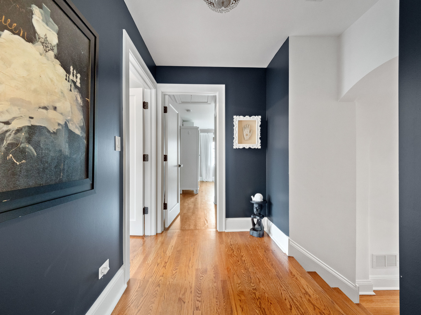 611 Wisner Street Park Ridge, IL 60068 - Photo 21 of 36 a view of a hallway with wooden floor and a bathroom