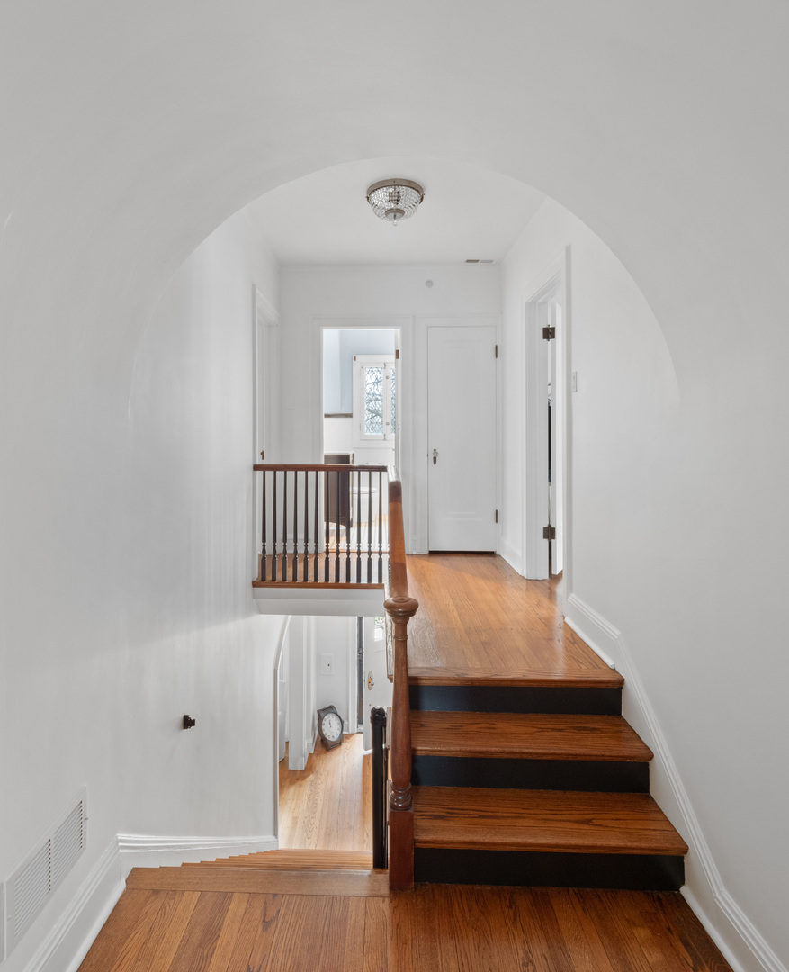 611 Wisner Street Park Ridge, IL 60068 - Photo 23 of 36 a bedroom with stairs and a bed
