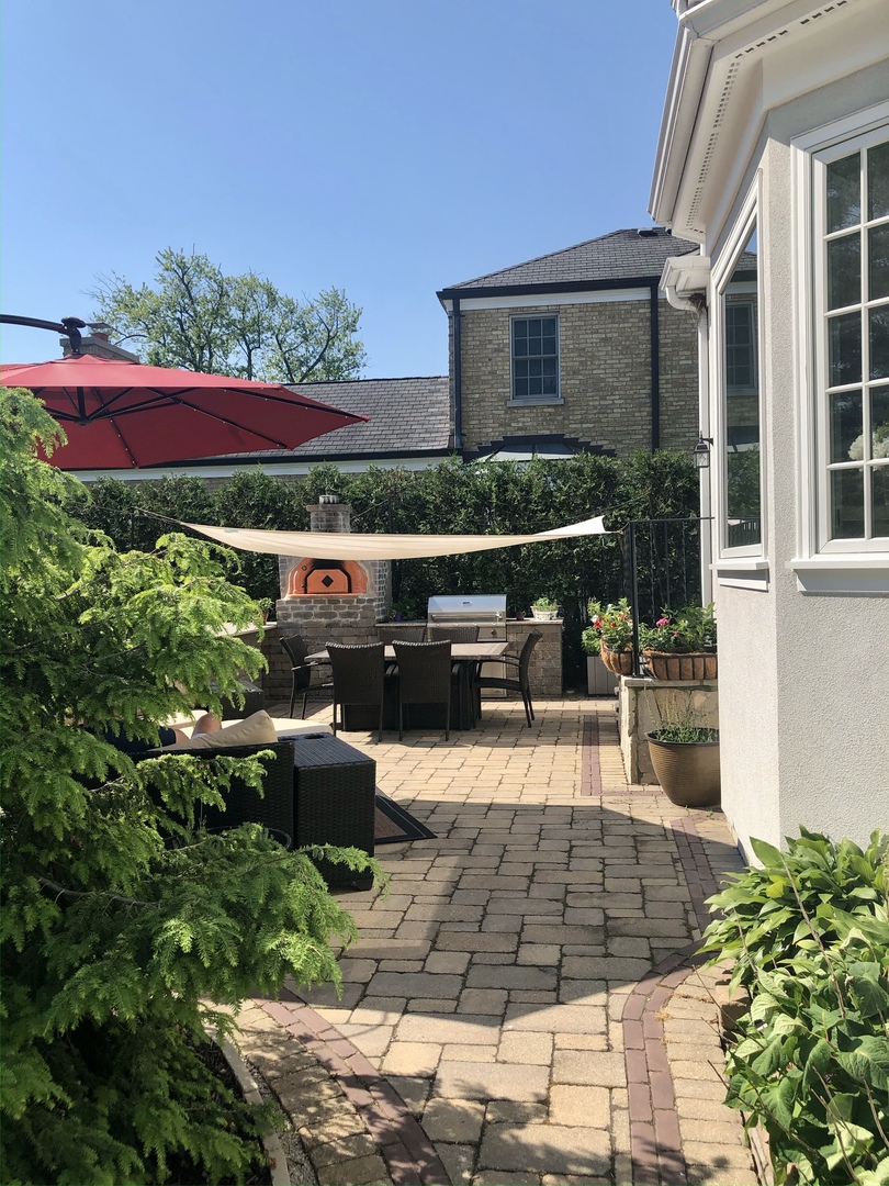 611 Wisner Street Park Ridge, IL 60068 - Photo 34 of 36 a view of a backyard with sitting area