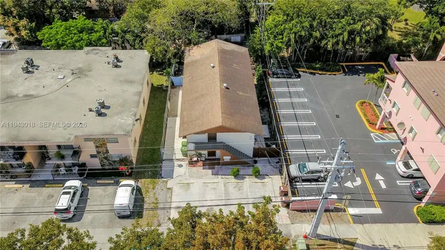 an aerial view of a house with outdoor space