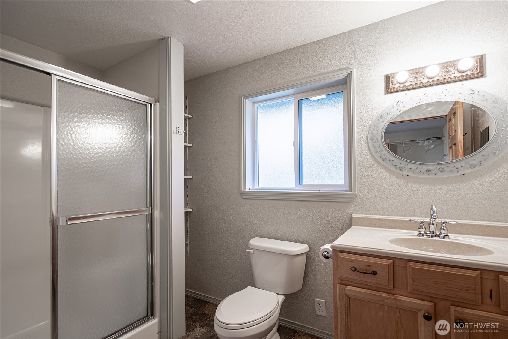 145 North Harris Avenue Manson, WA 98831 - Photo 17 of 28 a bathroom with a toilet sink and mirror