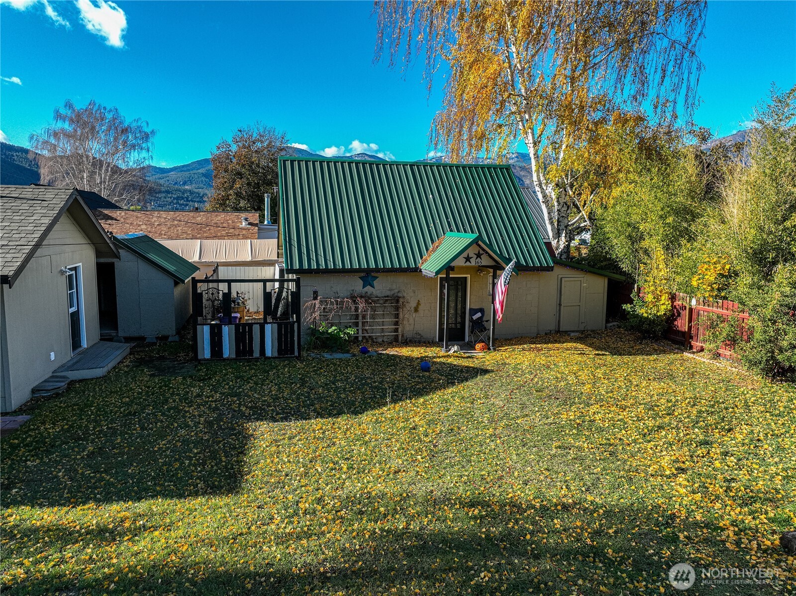 145 North Harris Avenue Manson, WA 98831 - Photo 19 of 28 a front view of a house with a garden
