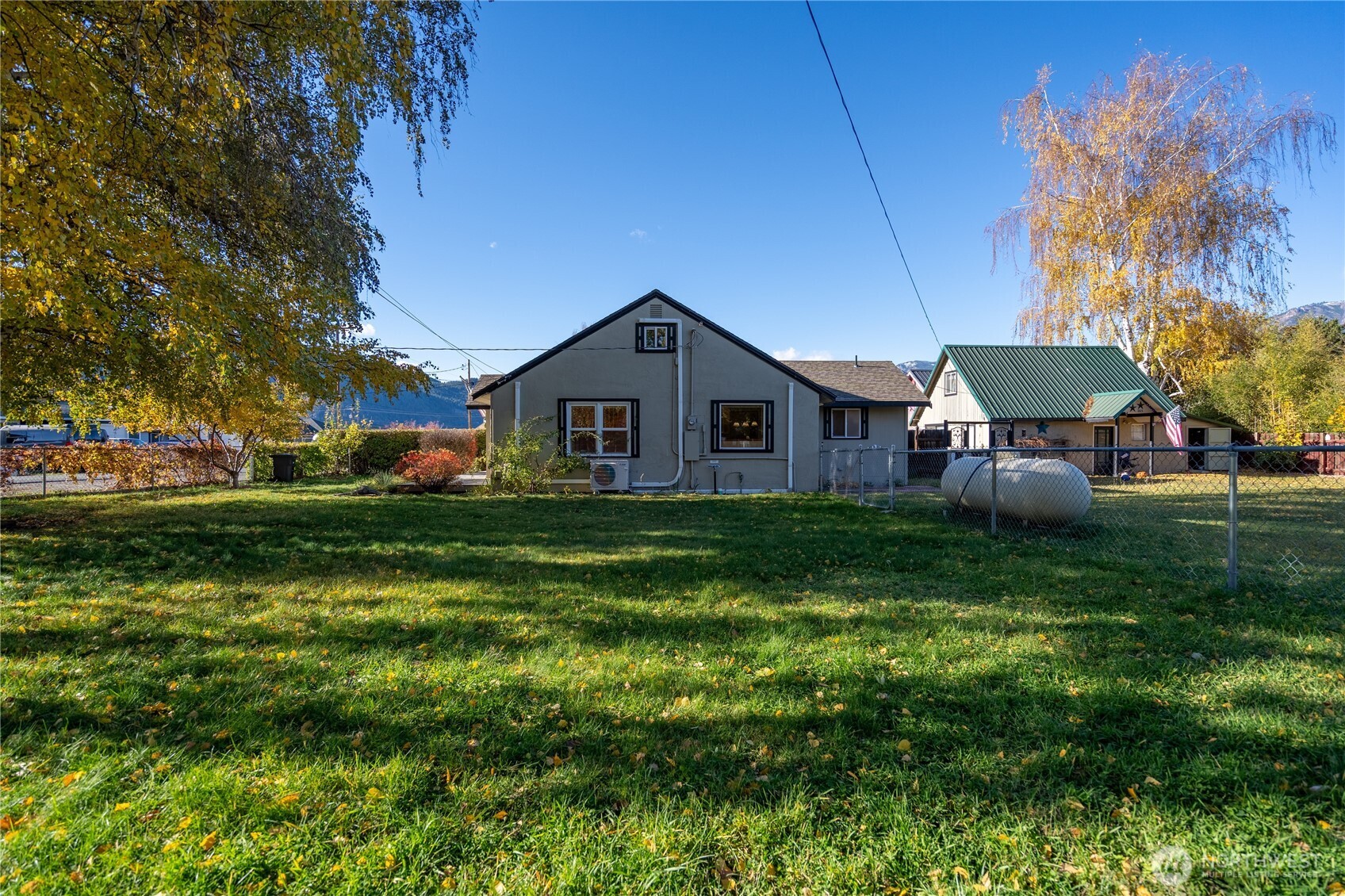 145 North Harris Avenue Manson, WA 98831 - Photo 25 of 28 a backyard of a house with table and chairs