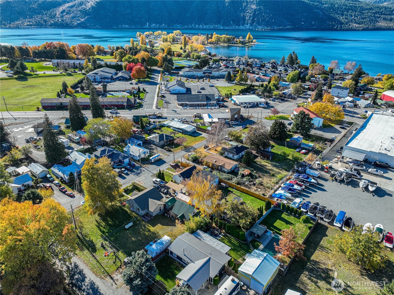 145 North Harris Avenue Manson, WA 98831 - Photo 28 of 28 an aerial view of a city with lots of residential buildings ocean and mountain view in back