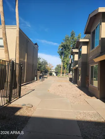 a view of a street with a building in the background
