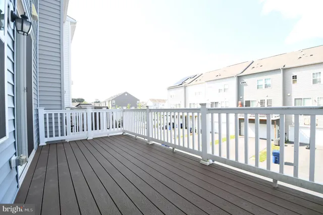 a bathroom with a sink vanity mirror and toilet