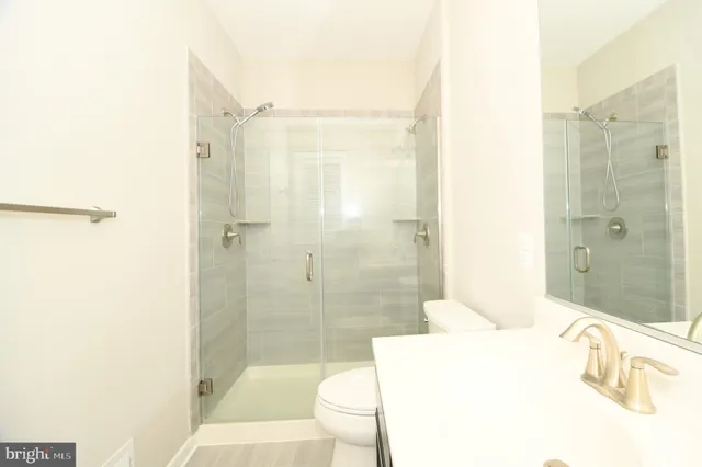 a large building with a large window and parking space