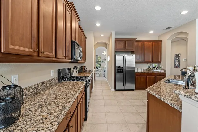 a large kitchen with granite countertop lots of counter top space