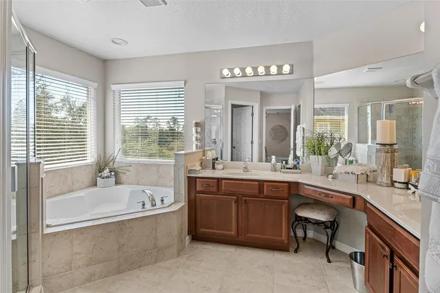 a bedroom with a bed and a mirror