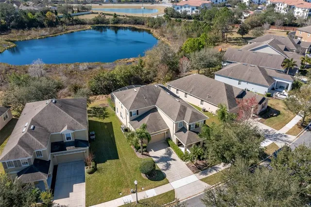 an aerial view of multiple houses with yard