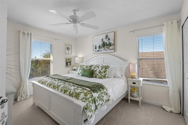 a view of a backyard with table and chairs under an umbrella