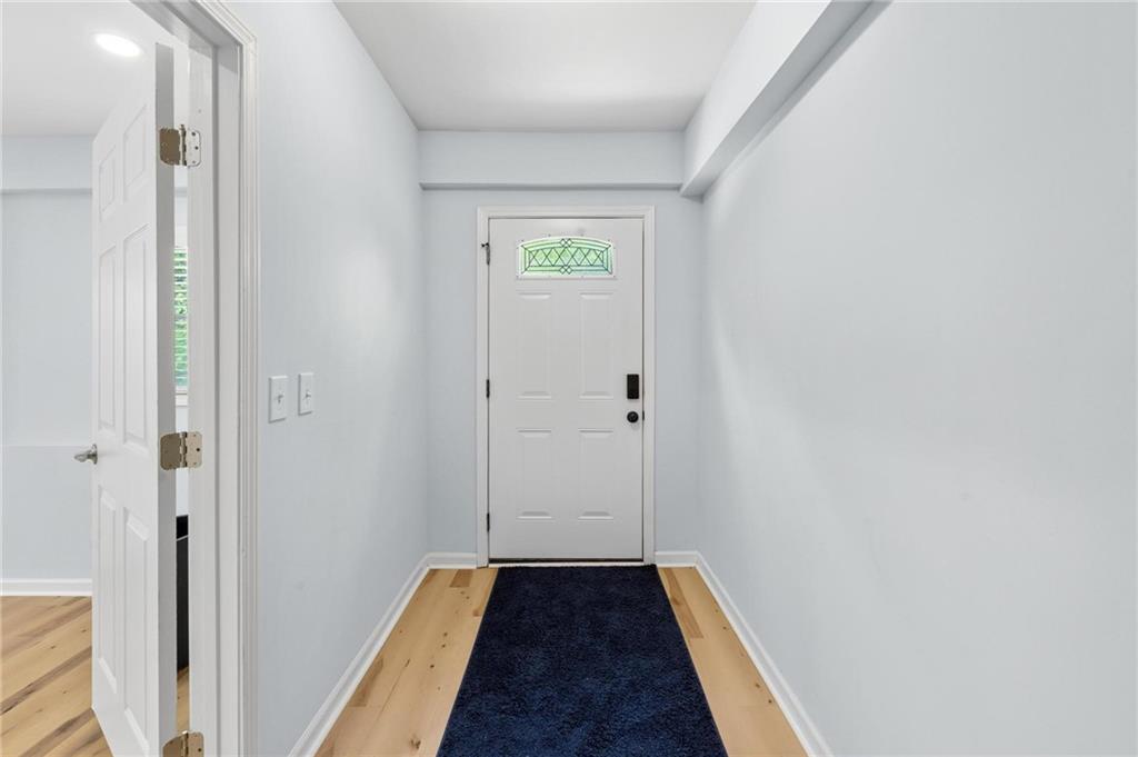 1745 Rockbridge Road Northwest Conyers, GA 30012 - Photo 23 of 32 a view of hallway with wooden floor