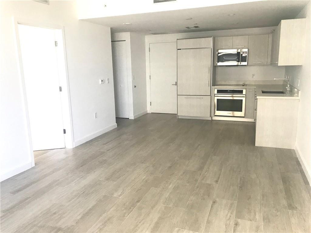 45 Southwest 9th Street, Unit 3707 Miami, FL 33130 - Photo 21 of 29 a view of a kitchen with electric appliances