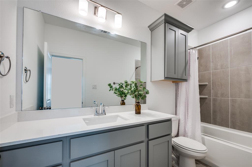 3718 Pelican Rst Way Arlington, TX 76005 - Photo 19 of 37 a bathroom with a sink a toilet and shower