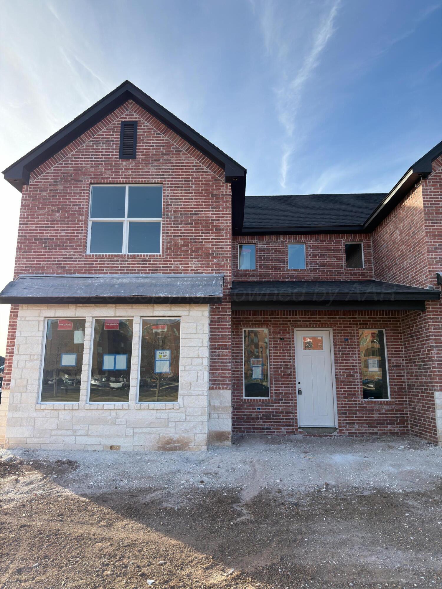 a front view of a house with garage