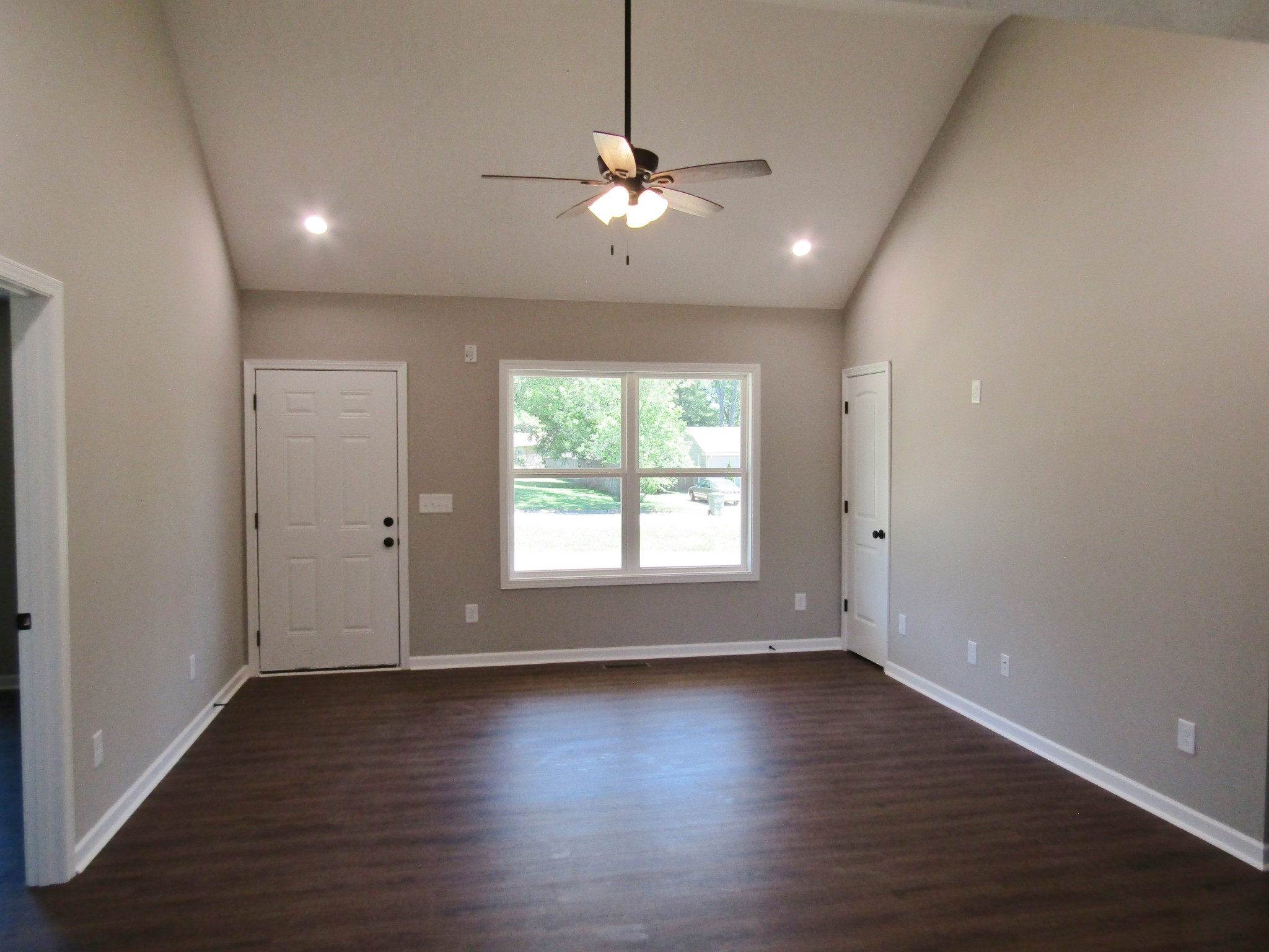 480 Crescent Factory Road Lawrenceburg, TN 38464 - Photo 3 of 14 an empty room with wooden floor and windows