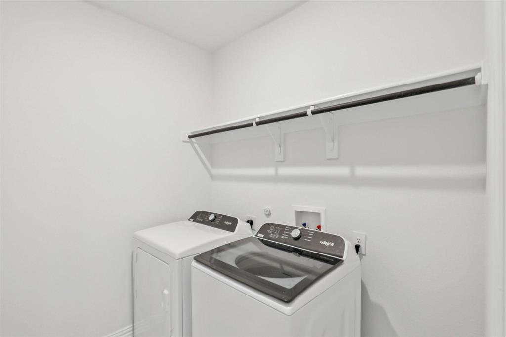 2100 Rannoch Street Sherman, TX 75092 - Photo 7 of 11 a utility room with dryer and washer