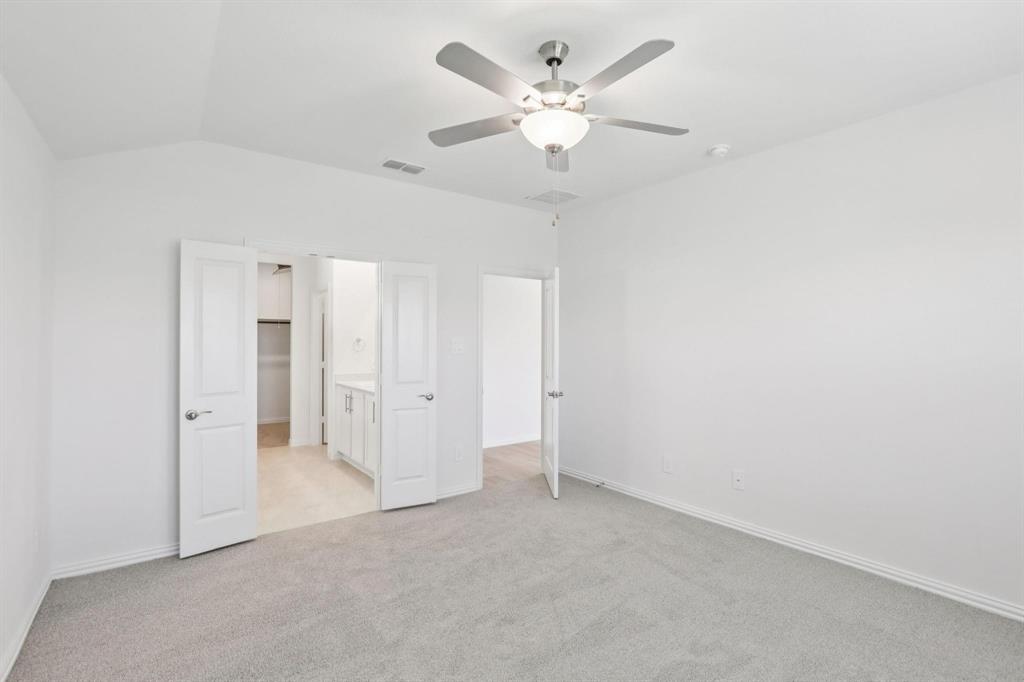 2100 Rannoch Street Sherman, TX 75092 - Photo 8 of 11 an empty room with fan and a ceiling fan