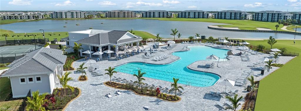 5583 Double Eagle Circle, Unit 4115 Ave Maria, FL 34142 - Photo 20 of 50 View of swimming pool with a water view and a patio