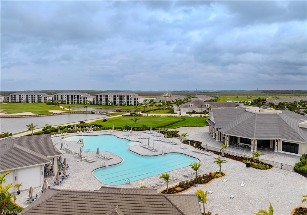 5583 Double Eagle Circle, Unit 4115 Ave Maria, FL 34142 - Photo 47 of 50 Pool featuring a water view and a patio area