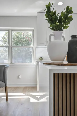 a view of table chair and window