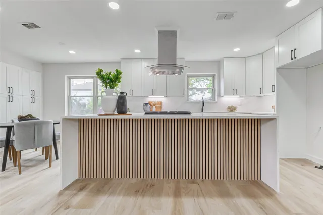 a kitchen with counter top space cabinets and appliances
