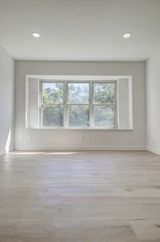 a bathroom with a double vanity sink mirror and shower