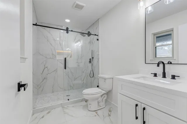 a bathroom with a sink and shower