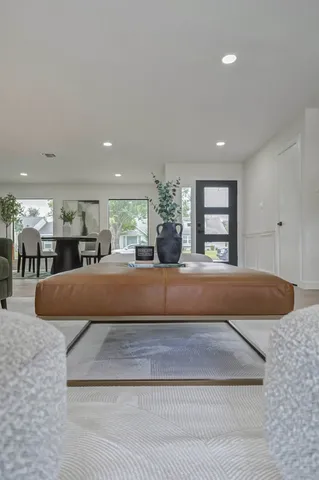 a bed sitting in a room and kitchen