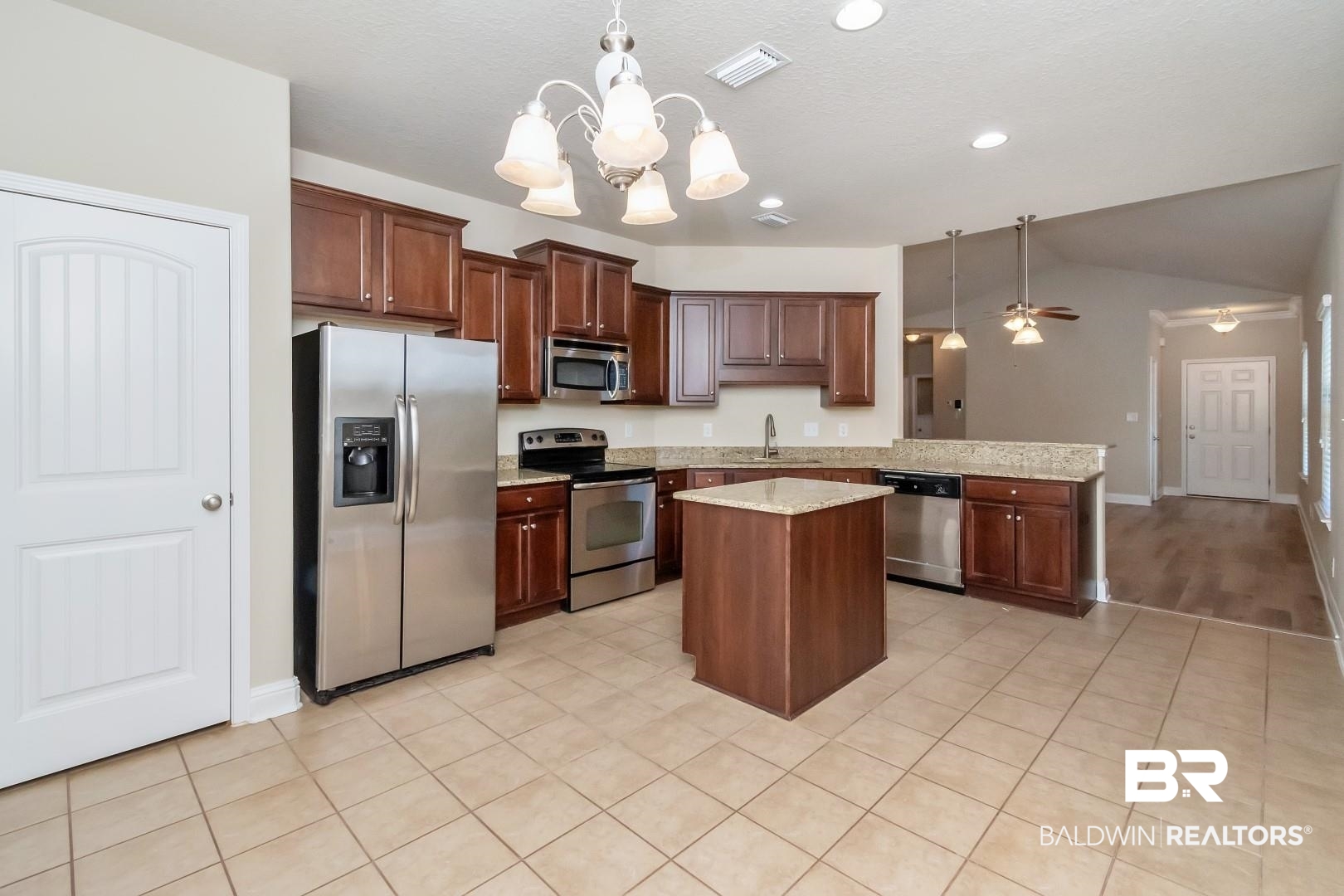 6144 Whitebark Drive Mobile, AL 36693 - Photo 9 of 33 Kitchen with ceiling fan with notable chandelier, sink, stainless steel appliances, and hanging light fixtures