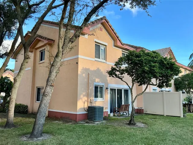 a view of a swimming pool with a garden