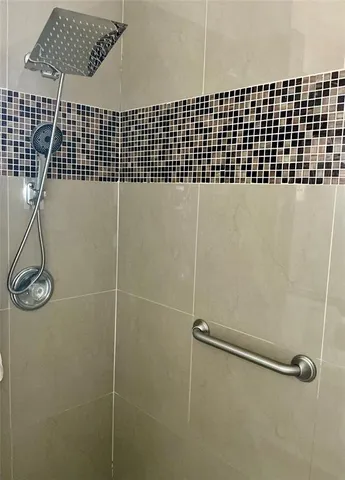 a bedroom with double bed and a night stand