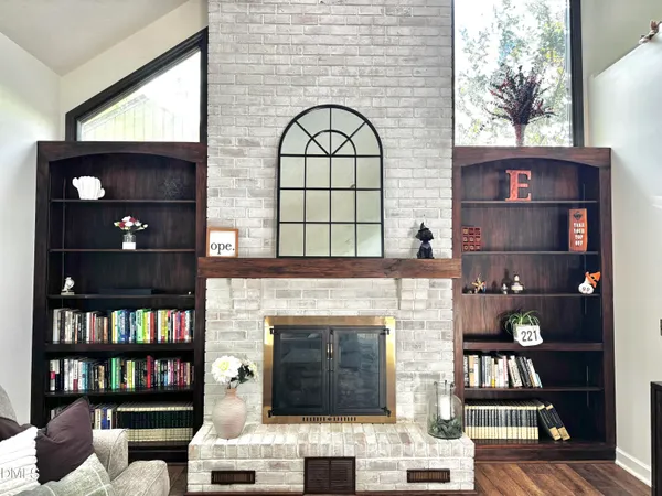 a living room with furniture ceiling fan and a rug