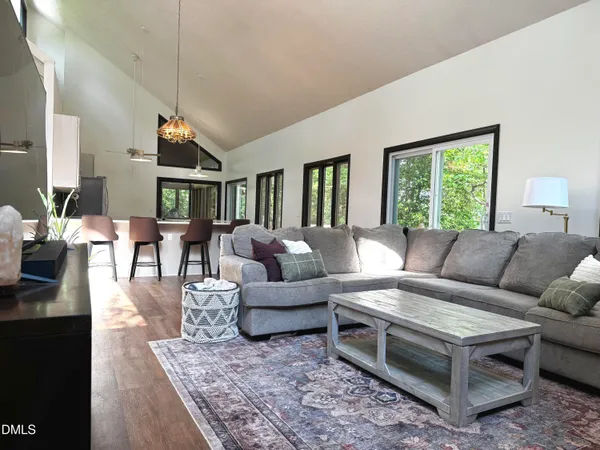 a kitchen with a sink a counter top space stainless steel appliances cabinets and a window