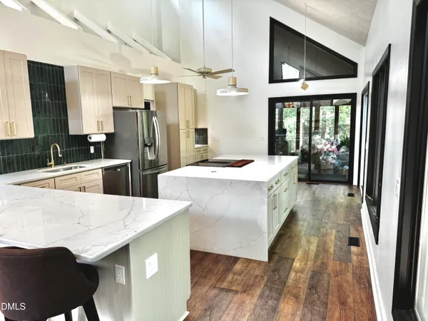 a kitchen with cabinets and stainless steel appliances
