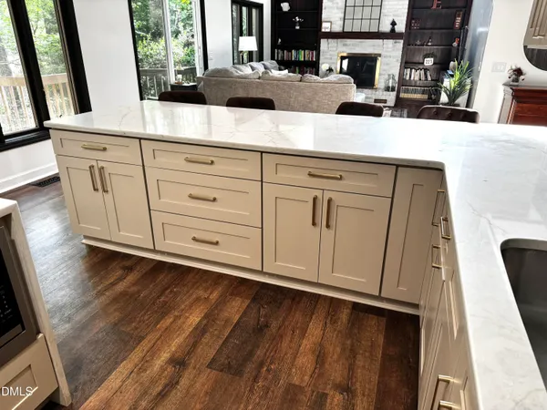 a kitchen with a sink a stove and a refrigerator