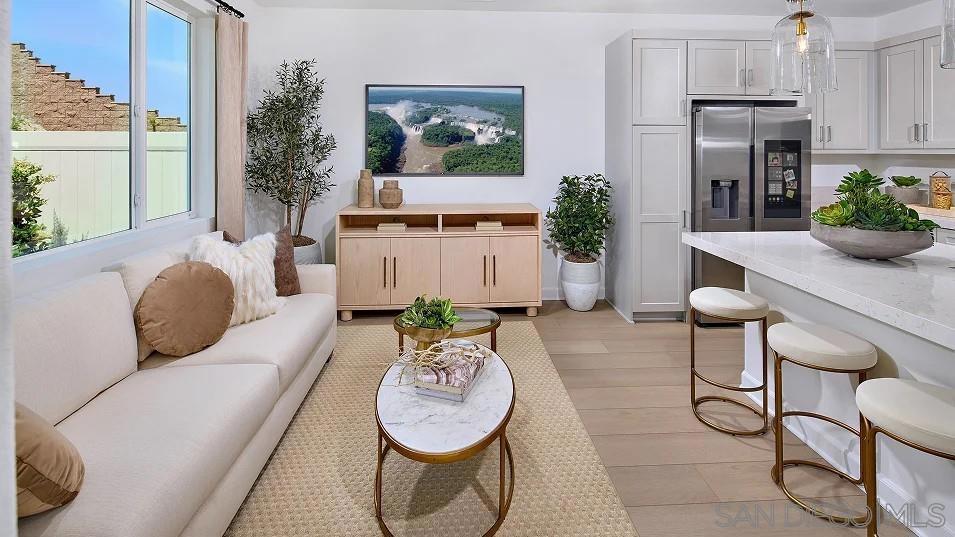 1057 Spike Street, Unit 2 Chula Vista, CA 91911 - Photo 8 of 18 a living room with furniture and a potted plant