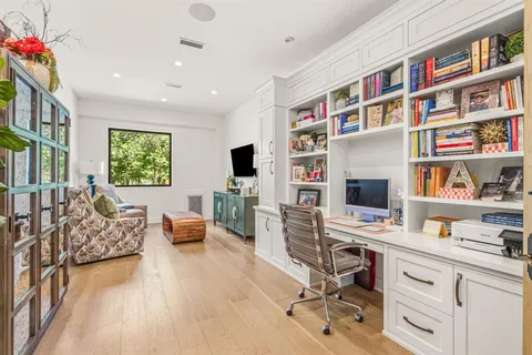 a bedroom with double bed and a window
