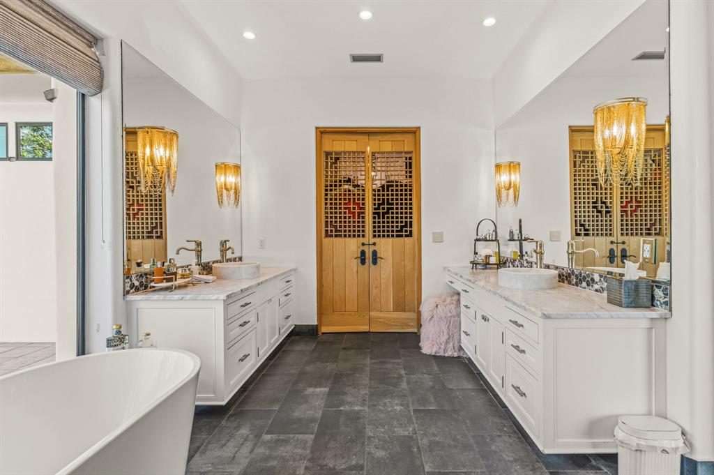 321 Verna Trail North Fort Worth, TX 76108 - Photo 21 of 40 a large bathroom with a granite countertop double vanity sink a mirror and a bathtub