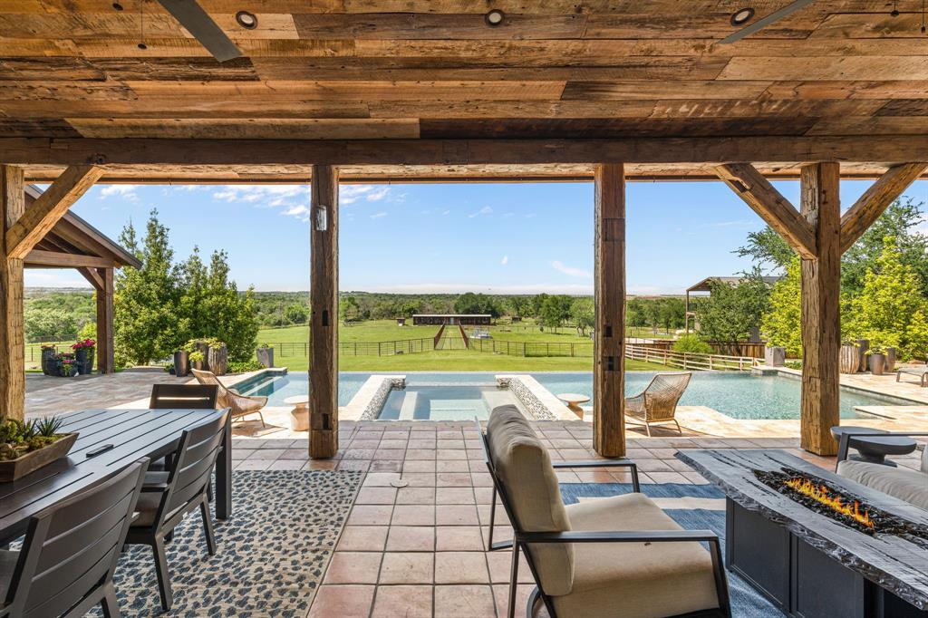 321 Verna Trail North Fort Worth, TX 76108 - Photo 26 of 40 a living room with patio furniture and a floor to ceiling window