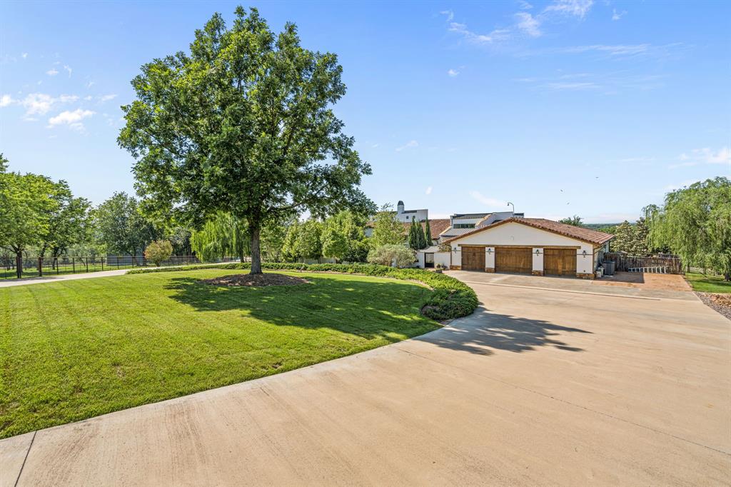 321 Verna Trail North Fort Worth, TX 76108 - Photo 3 of 40 a front view of a house with a yard