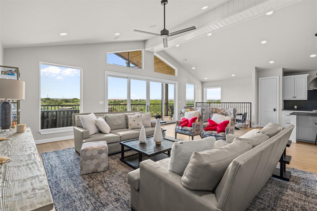 321 Verna Trail North Fort Worth, TX 76108 - Photo 32 of 40 a living room with patio furniture and a fireplace