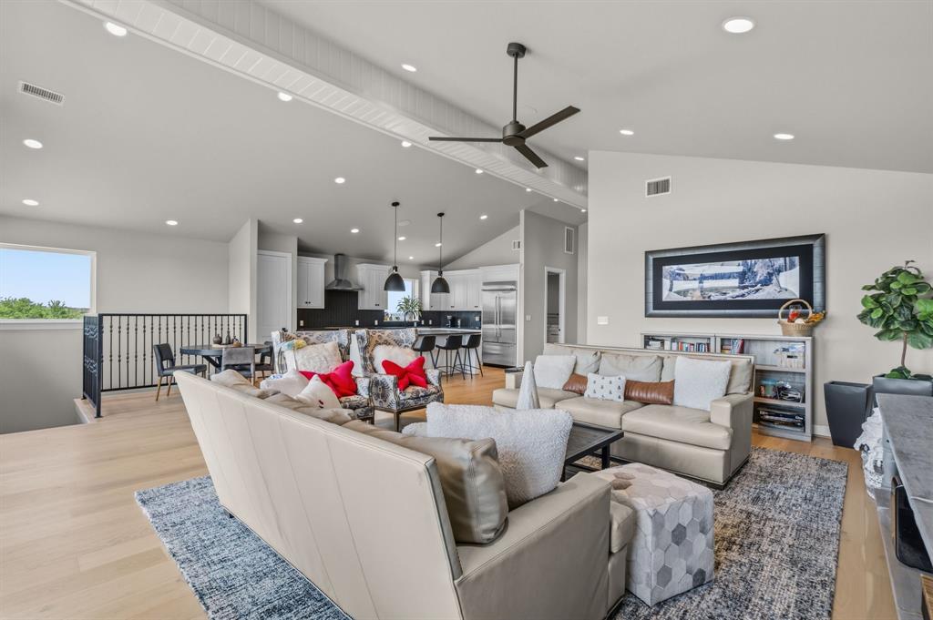 321 Verna Trail North Fort Worth, TX 76108 - Photo 33 of 40 a living room with furniture kitchen and a chandelier