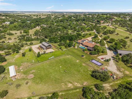 an aerial view of residential houses with outdoor space