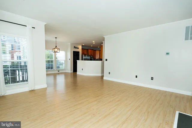 a view of a kitchen with a sink and a window