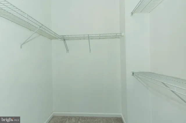 a view of a room with racks on the wall